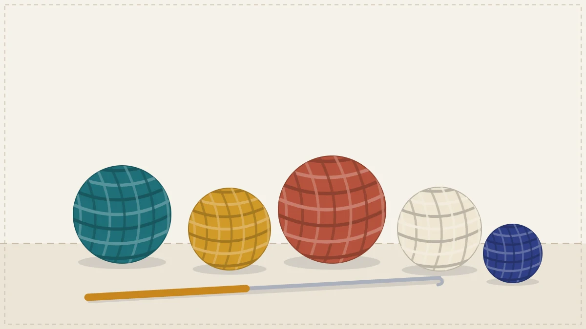 Balls and cakes of cotton yarn in several colors with a crochet hook resting across them