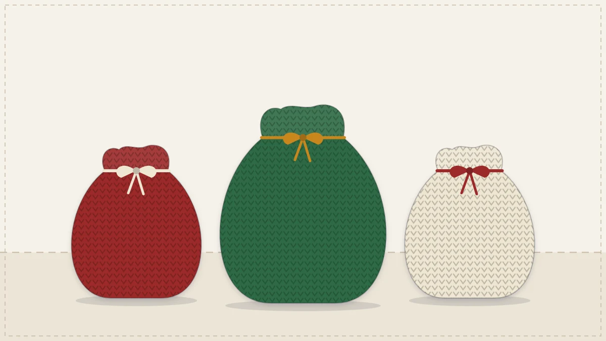 Three small crocheted drawstring gift bags in deep red, green and cream tied with ribbon