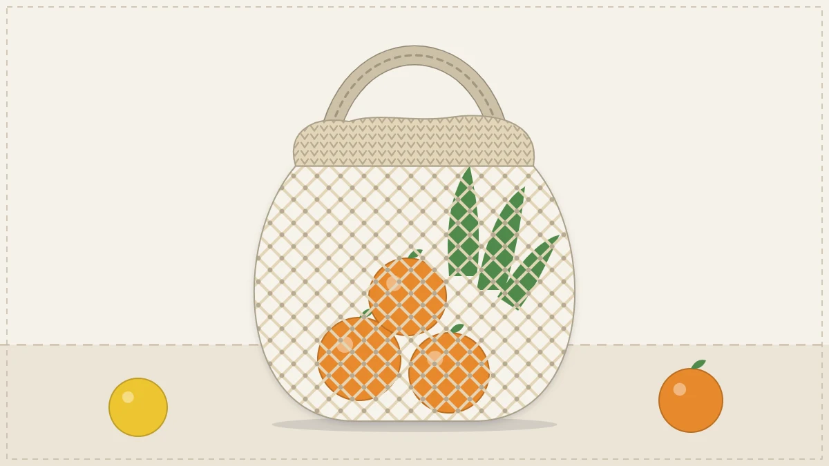 An open mesh crocheted market bag in natural cotton holding oranges and a leafy bunch of greens