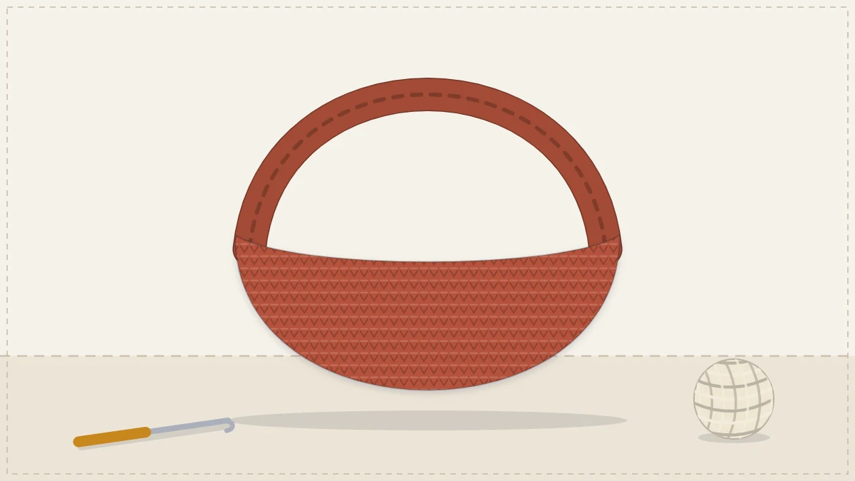 A slouchy crescent-shaped crocheted shoulder bag with one wide strap in terracotta
