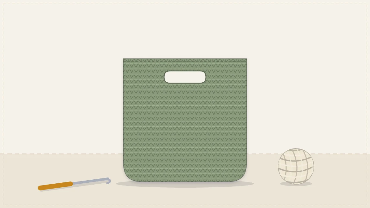 A seamless crocheted bag with an oval base and cut-out handles, in sage green