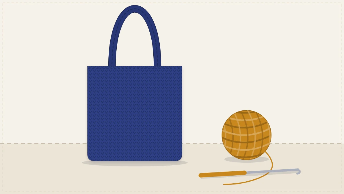 A simple crocheted tote lying flat beside a ball of cotton yarn and a crochet hook